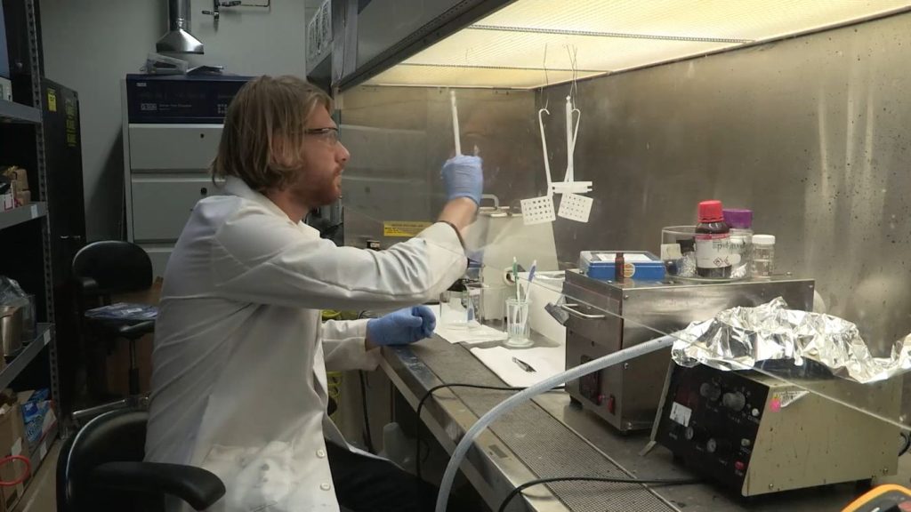 A scientist working with laboratory equipment